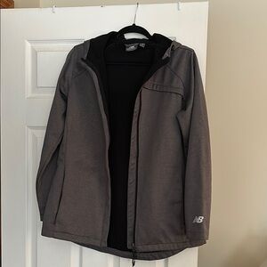 New Balance full-zip lightweight jacket with hood.